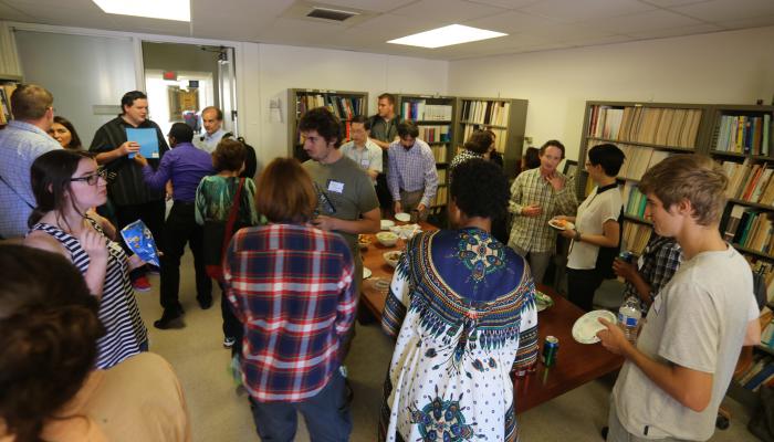 Graduate students and faculty enjoying snacks
