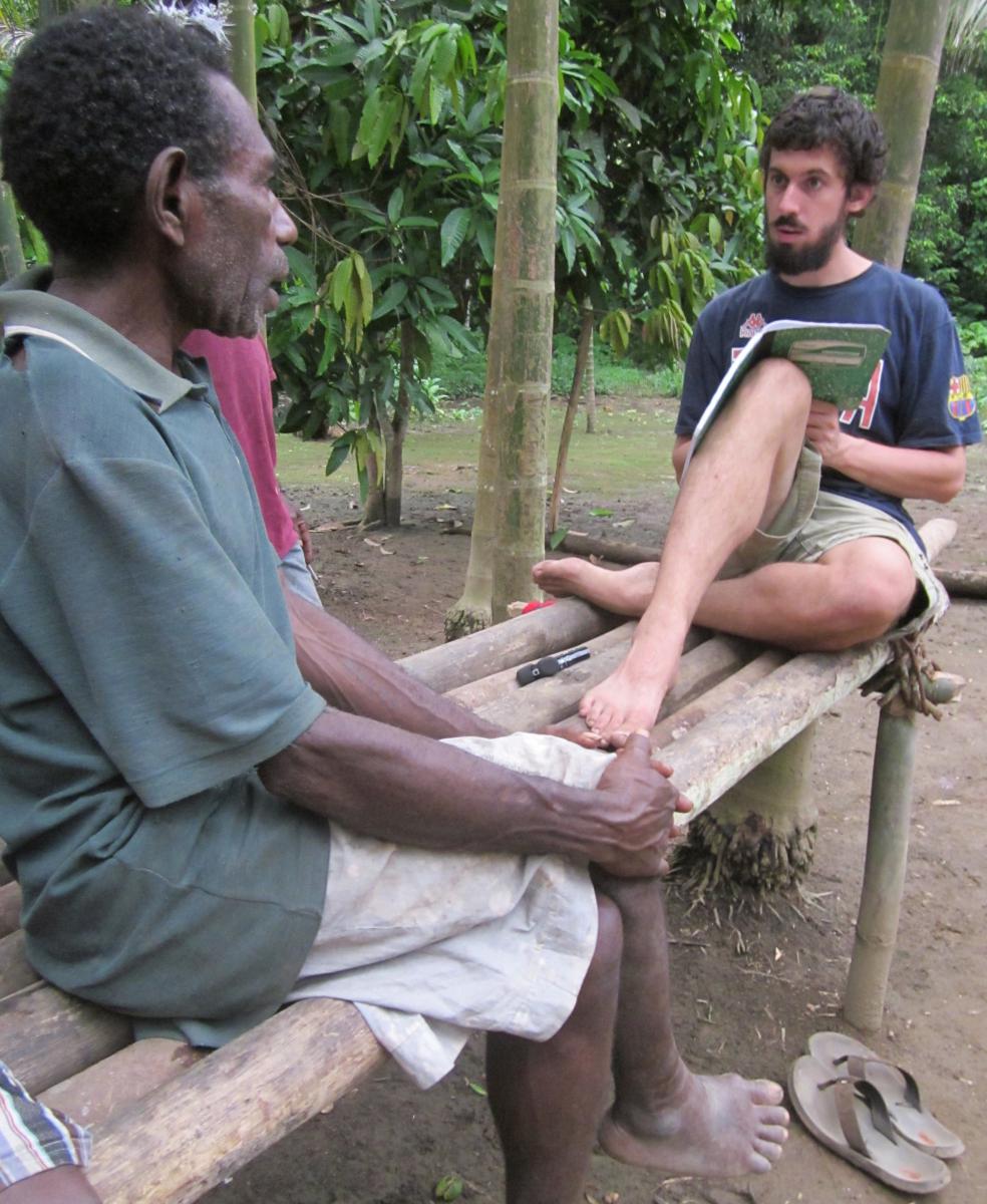 Graduate student Don Daniels working with a consultant in Papua New Guinea.