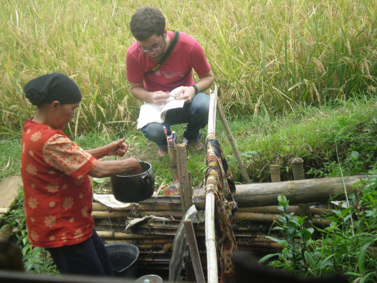 Graduate student Brad McDonnell working with a consultant in Indonesia